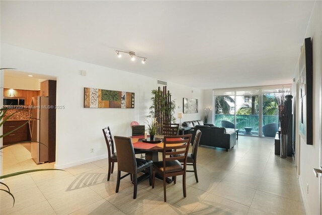 4001 S Ocean Dr Unit 3P, Hollywood, FL 33019 - dining room with light tile patterned flooring and baseboards