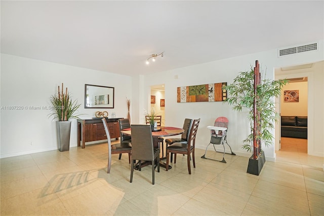 4001 S Ocean Dr Unit 3P, Hollywood, FL 33019 - dining area with light tile patterned flooring and baseboards