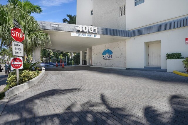 4001 S Ocean Dr Unit 3P, Hollywood, FL 33019 - entrance to property featuring stucco siding and a carport