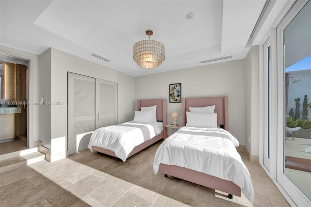 5600 Collins Ave Ph C, Ph C, Miami Beach, FL 33140 - bedroom featuring a tray ceiling, a closet, and access to exterior