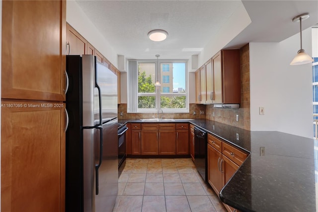 2000 N Bayshore Dr Unit 228, Miami, FL 33137 - kitchen featuring black appliances, tasteful backsplash, a sink, and brown cabinets