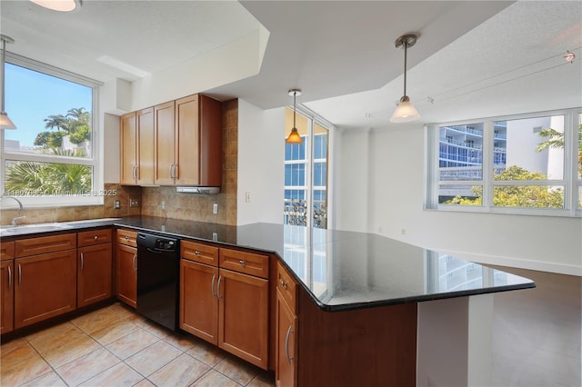 2000 N Bayshore Dr Unit 228, Miami, FL 33137 - kitchen featuring black dishwasher, a sink, a peninsula, tasteful backsplash, and light tile patterned floors
