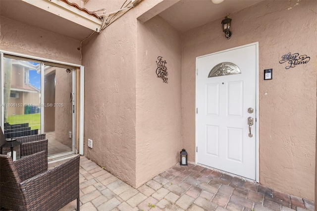 8252 NW 191st Ln Unit 15R, Hialeah, FL 33015 - doorway to property featuring stucco siding