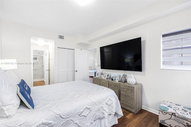 8252 NW 191st Ln Unit 15R, Hialeah, FL 33015 - bedroom featuring dark wood finished floors, baseboards, and ensuite bathroom
