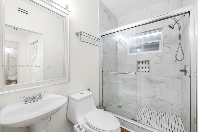 8252 NW 191st Ln Unit 15R, Hialeah, FL 33015 - full bathroom with toilet, a sink, and a marble finish shower