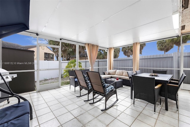 8252 NW 191st Ln Unit 15R, Hialeah, FL 33015 - sunroom / solarium with outdoor lounge area, tile patterned floors, and outdoor dining space