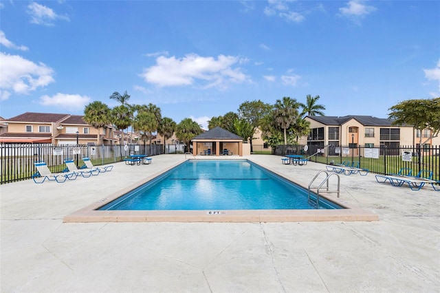 8252 NW 191st Ln Unit 15R, Hialeah, FL 33015 - community pool featuring a residential view and a patio