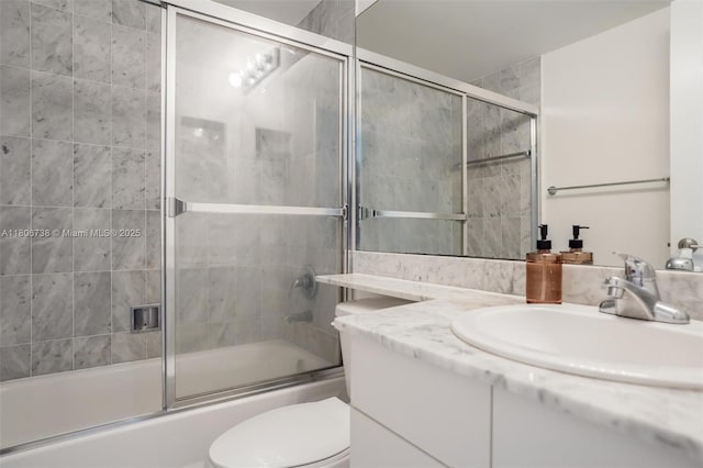 800 Claughton Island Dr Unit 1504, Miami, FL 33131 - bathroom featuring bath / shower combo with glass door, toilet, and vanity