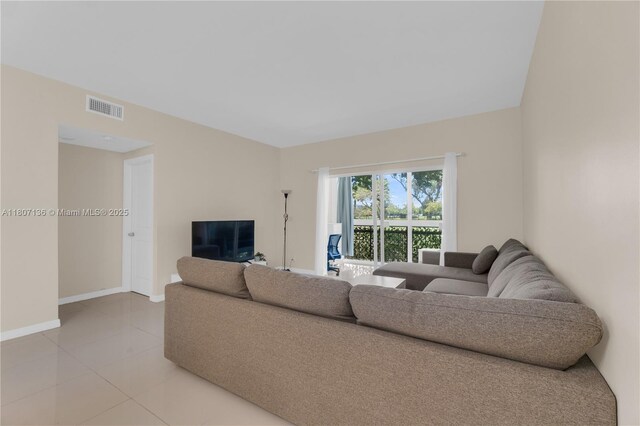 4400 Hillcrest Dr Unit 107A, Hollywood, FL 33021 - living area with baseboards and light tile patterned floors