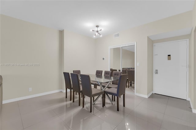 4400 Hillcrest Dr Unit 107A, Hollywood, FL 33021 - dining area featuring light tile patterned floors, a chandelier, and baseboards