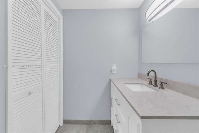 4400 Hillcrest Dr Unit 107A, Hollywood, FL 33021 - bathroom with a closet, vanity, and baseboards