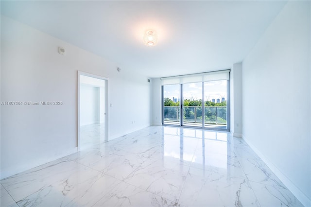 16385 Biscayne Blvd Unit 417, North Miami Beach, FL 33160 - empty room featuring marble tiled flooring and floor to ceiling windows