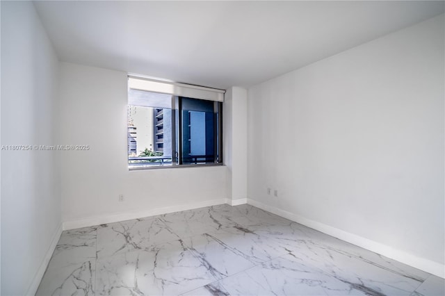 16385 Biscayne Blvd Unit 417, North Miami Beach, FL 33160 - unfurnished room featuring marble look tiles and baseboards