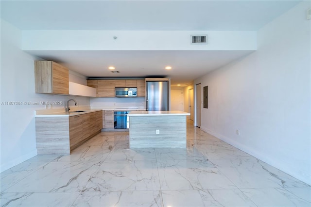16385 Biscayne Blvd Unit 417, North Miami Beach, FL 33160 - kitchen featuring stainless steel microwave, modern cabinets, a sink, baseboards, and light countertops