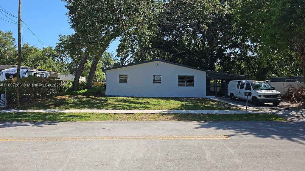 4110 SW 32nd Ct, West Park, FL 33023 - view of front facade featuring a front yard, stucco siding, and driveway