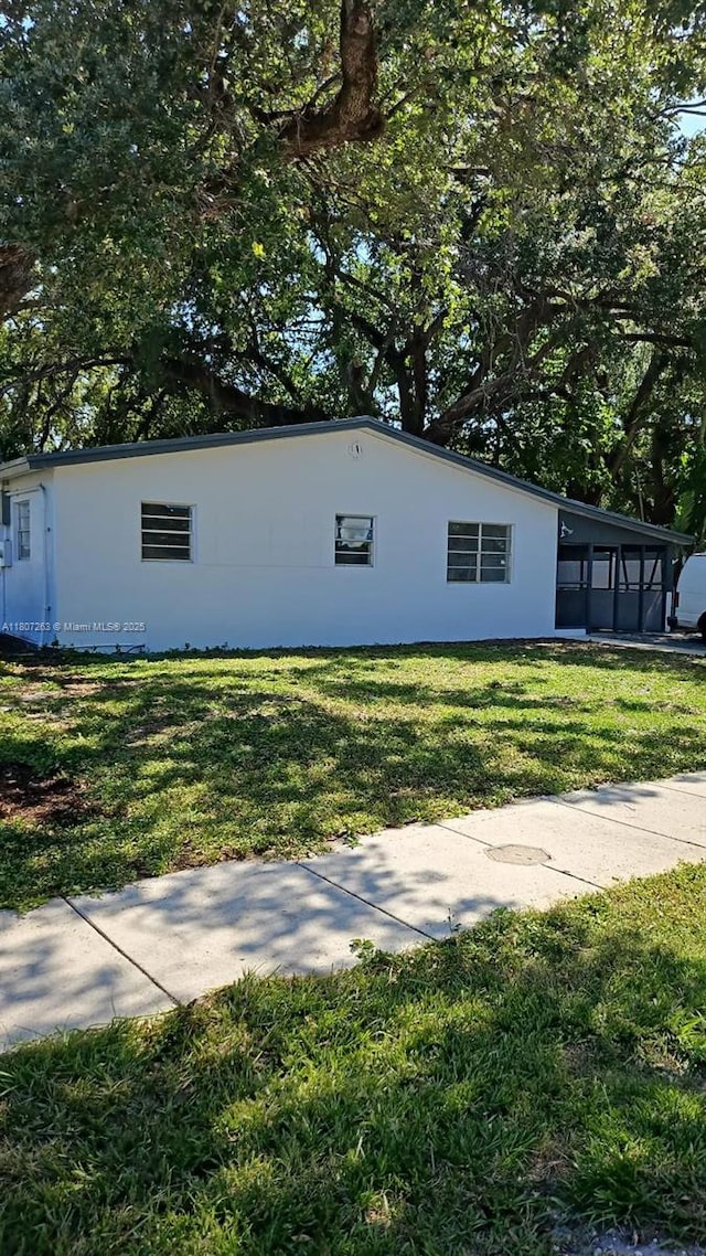4110 SW 32nd Ct, West Park, FL 33023 - view of side of property with a yard and stucco siding