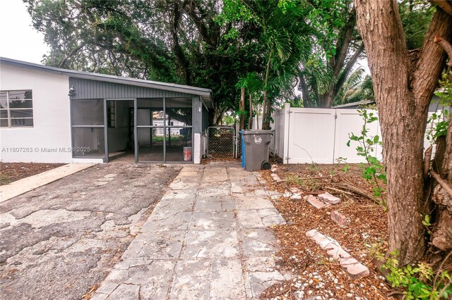 4110 SW 32nd Ct, West Park, FL 33023 - view of yard with a gate and a sunroom