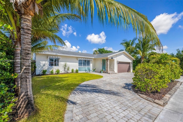 6847 NW 24th Way, Fort Lauderdale, FL 33309 - view of front of property featuring stucco siding, decorative driveway, an attached garage, and a front yard