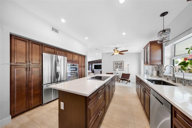 6847 NW 24th Way, Fort Lauderdale, FL 33309 - kitchen featuring stainless steel appliances, a center island, light countertops, ceiling fan, and recessed lighting