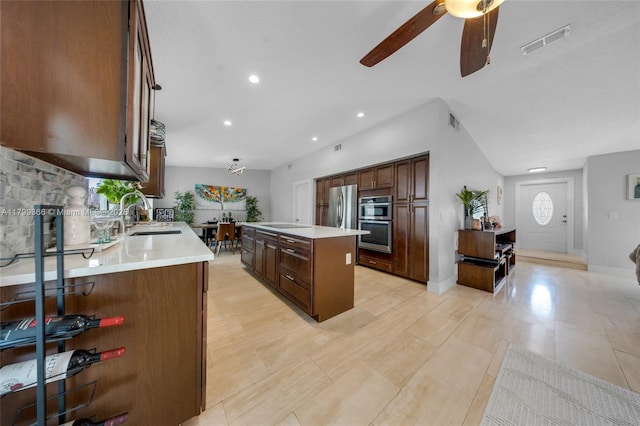 6847 NW 24th Way, Fort Lauderdale, FL 33309 - kitchen featuring a center island, ceiling fan, light countertops, appliances with stainless steel finishes, and recessed lighting