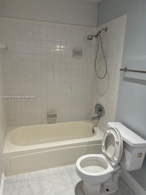 927 Riverside Dr Unit 326, Coral Springs, FL 33071 - bathroom featuring toilet, bathtub / shower combination, tile patterned flooring, and baseboards