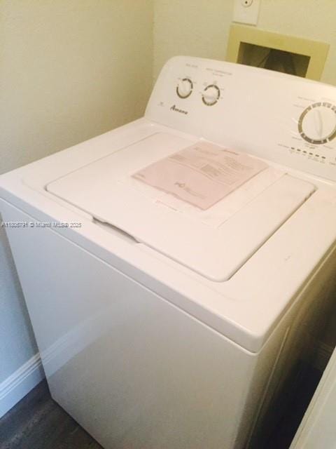 927 Riverside Dr Unit 326, Coral Springs, FL 33071 - laundry area with washer / dryer, baseboards, and dark wood-type flooring