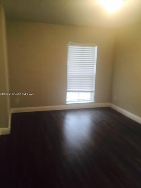 927 Riverside Dr Unit 326, Coral Springs, FL 33071 - unfurnished room with dark wood-type flooring and baseboards