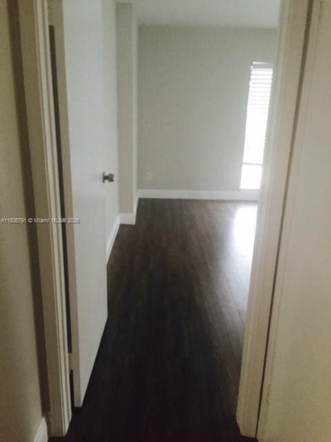 927 Riverside Dr Unit 326, Coral Springs, FL 33071 - corridor featuring dark wood-type flooring and baseboards