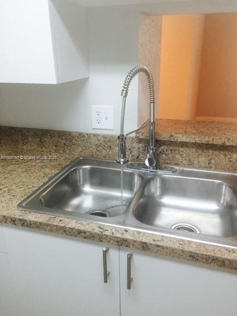 927 Riverside Dr Unit 326, Coral Springs, FL 33071 - kitchen view of a sink and white cabinetry
