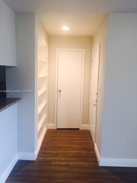 927 Riverside Dr Unit 326, Coral Springs, FL 33071 - corridor featuring wood finished floors, baseboards, built in shelves, and recessed lighting