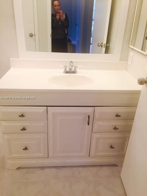 927 Riverside Dr Unit 326, Coral Springs, FL 33071 - bathroom with vanity and tile patterned flooring