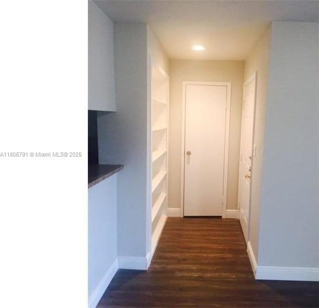 927 Riverside Dr Unit 326, Coral Springs, FL 33071 - corridor featuring dark wood-style flooring, baseboards, and recessed lighting
