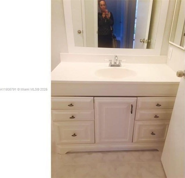 927 Riverside Dr Unit 326, Coral Springs, FL 33071 - bathroom featuring vanity and tile patterned flooring