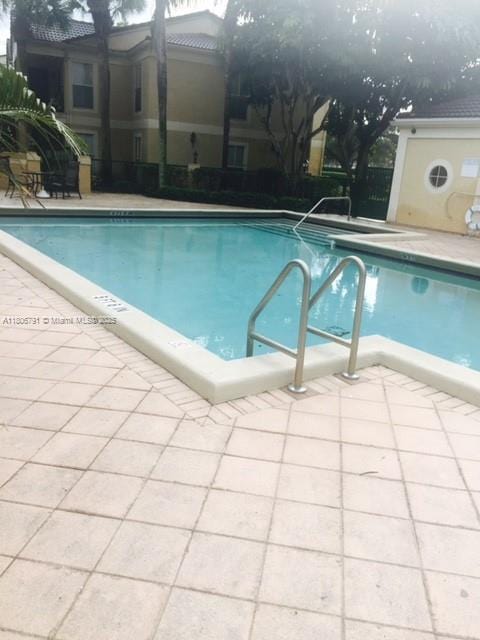 927 Riverside Dr Unit 326, Coral Springs, FL 33071 - community pool with a patio area