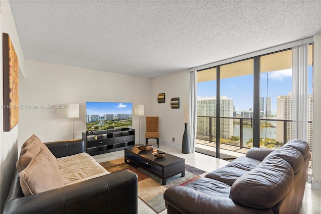 18181 NE 31st Ct Unit Ph07, Aventura, FL 33160 - living area featuring a wall of windows and a textured ceiling