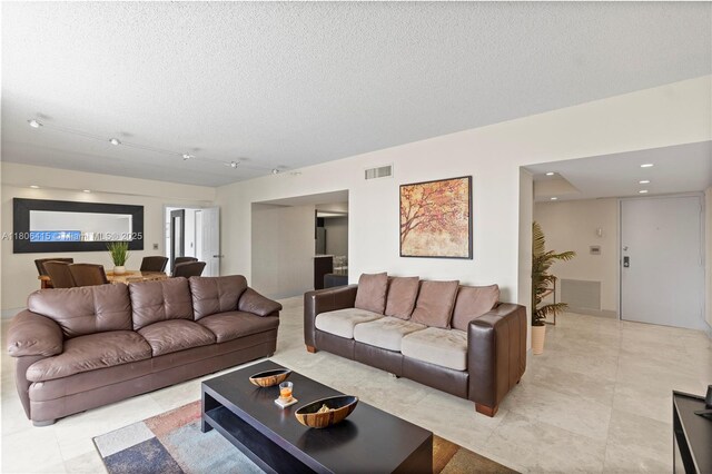 18181 NE 31st Ct Unit Ph07, Aventura, FL 33160 - living area featuring a textured ceiling