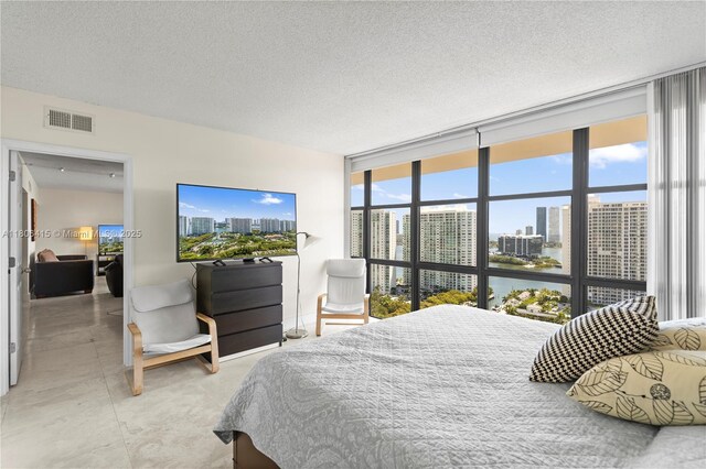 18181 NE 31st Ct Unit Ph07, Aventura, FL 33160 - bedroom featuring floor to ceiling windows and a textured ceiling