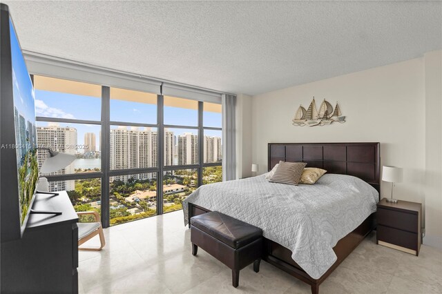 18181 NE 31st Ct Unit Ph07, Aventura, FL 33160 - bedroom with a wall of windows, multiple windows, a city view, and a textured ceiling