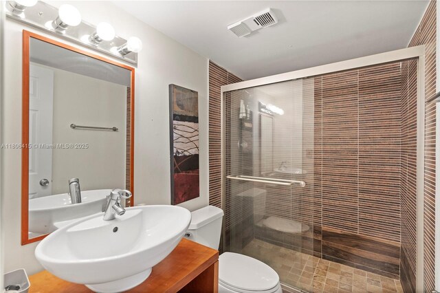 18181 NE 31st Ct Unit Ph07, Aventura, FL 33160 - full bathroom with a shower stall, toilet, and a sink