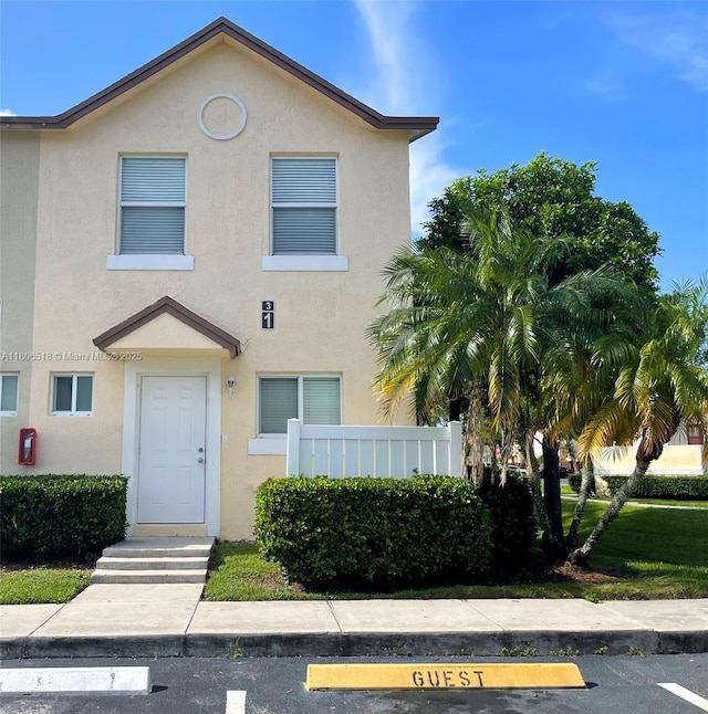 6621 Winfield Blvd Unit 1, Margate, FL 33063 - view of property with stucco siding and uncovered parking