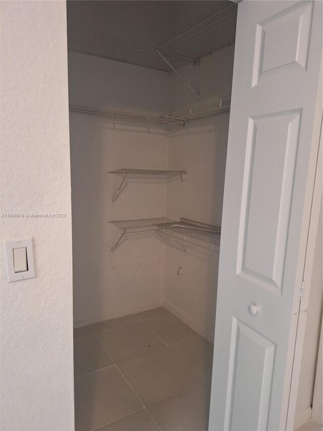 6621 Winfield Blvd Unit 1, Margate, FL 33063 - walk in closet with tile patterned flooring