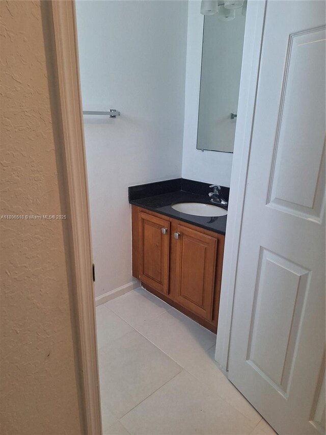 6621 Winfield Blvd Unit 1, Margate, FL 33063 - bathroom featuring vanity, tile patterned flooring, and a textured wall