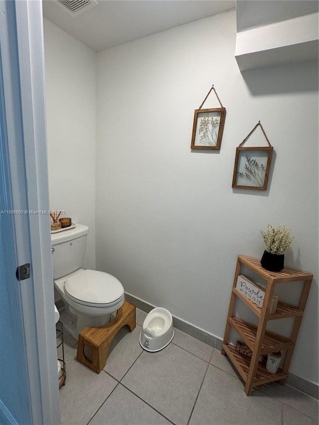 28577 SW 134th Ct, Homestead, FL 33033 - bathroom with toilet, tile patterned flooring, and baseboards
