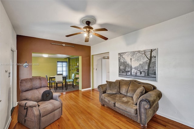 45 NW 127th St, North Miami, FL 33168 - living room featuring ceiling fan, light wood-style flooring, and baseboards