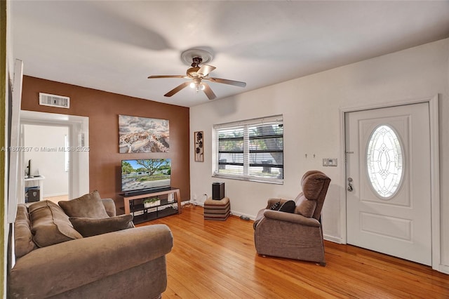 45 NW 127th St, North Miami, FL 33168 - living room featuring light wood-style flooring, a ceiling fan, and baseboards
