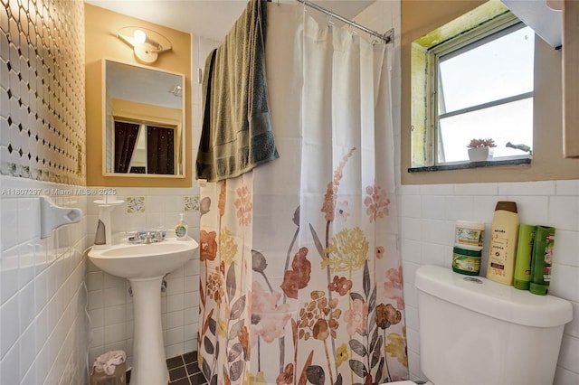 45 NW 127th St, North Miami, FL 33168 - full bathroom with tile walls, toilet, and a shower with curtain