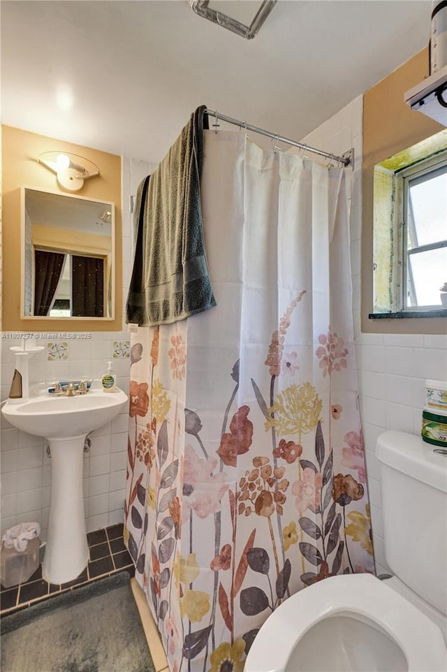 45 NW 127th St, North Miami, FL 33168 - bathroom with tile walls, toilet, and curtained shower