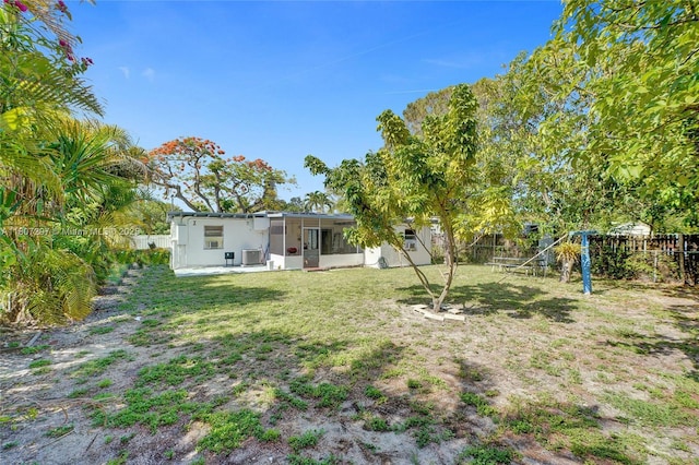 45 NW 127th St, North Miami, FL 33168 - view of yard featuring a sunroom and a playground