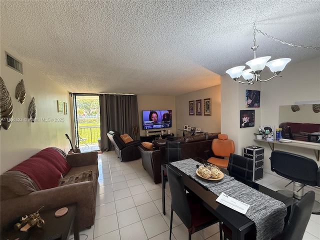 12209 SW 14th Ln Unit 1101, Miami, FL 33184 - dining space featuring a textured ceiling, light tile patterned flooring, and a chandelier