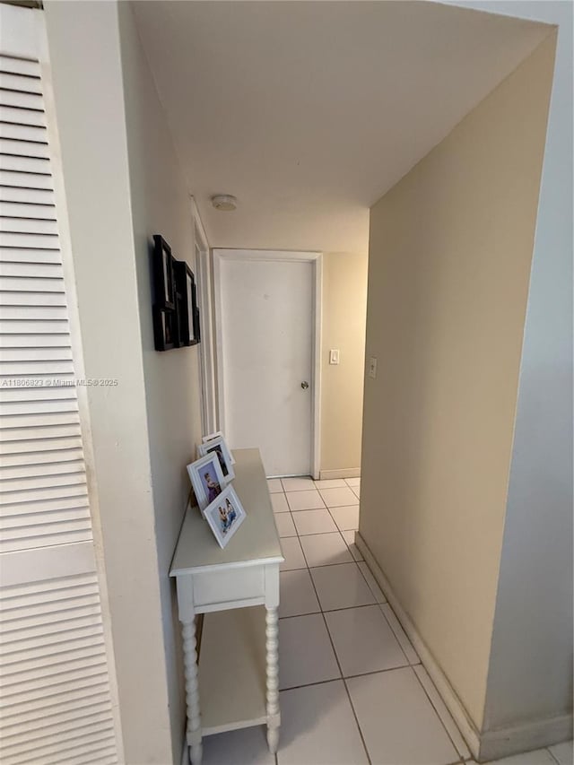 12209 SW 14th Ln Unit 1101, Miami, FL 33184 - corridor featuring light tile patterned floors and baseboards